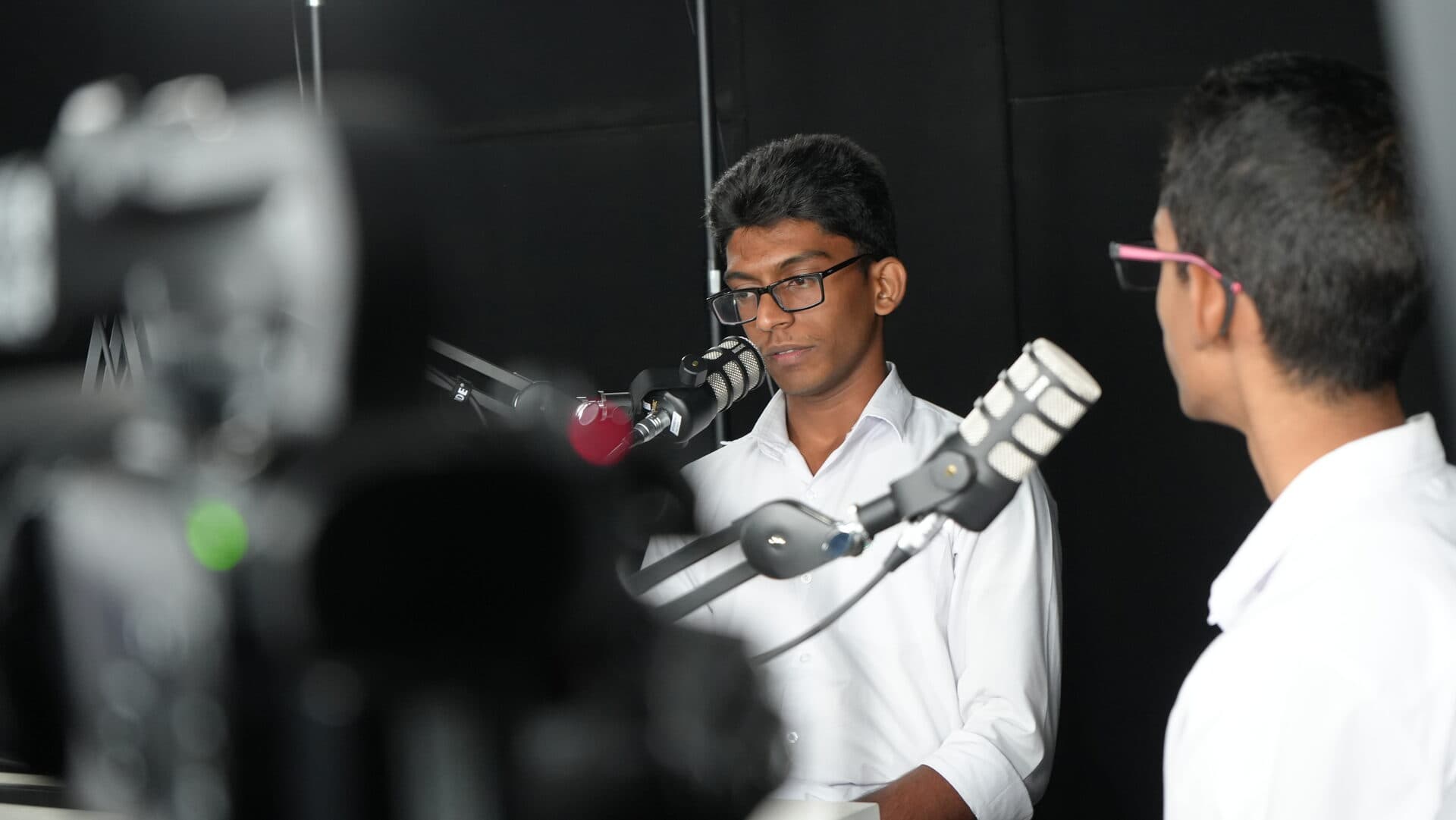 Close-up of a student during a podcast interview in the studio