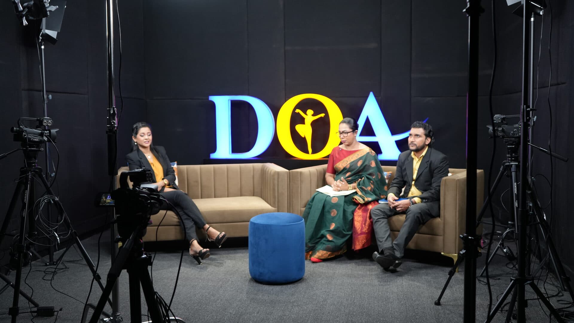 Panel discussion being filmed on the DOA TV studio set