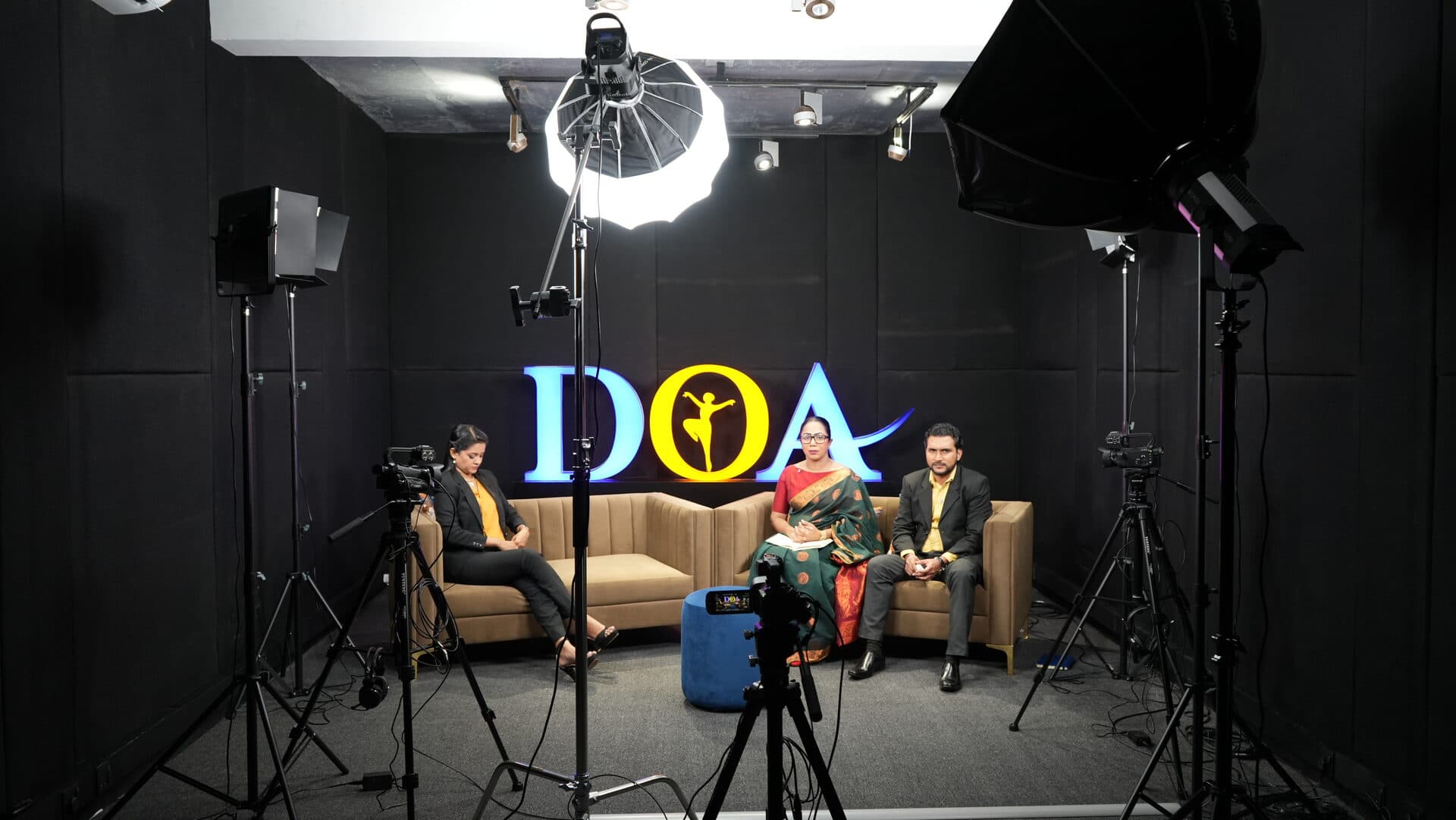 Wide shot of the DOA TV studio set during a live recording session